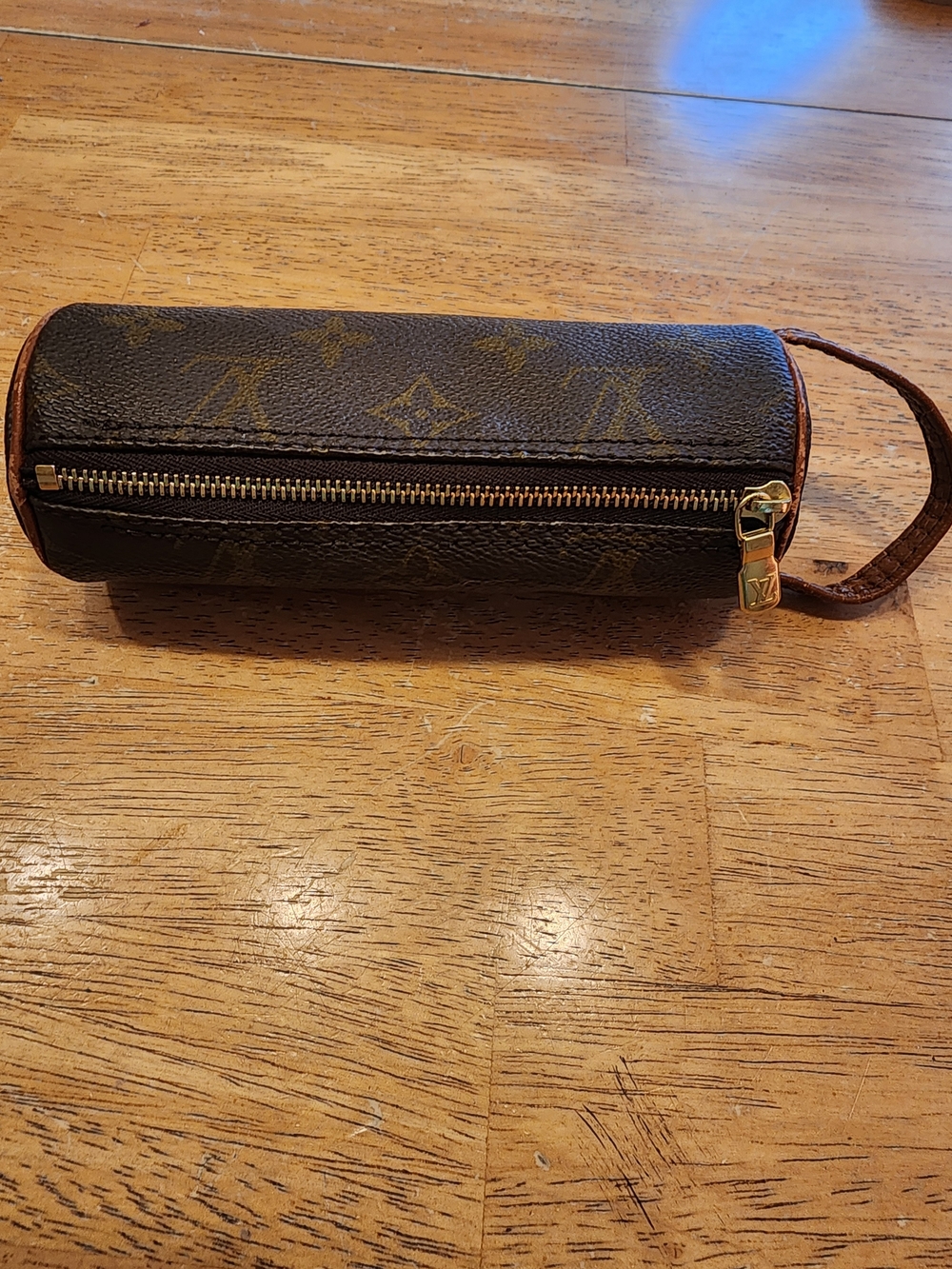 Louis Vuitton Mini Papillon features monogram canvas with brown leather Trim